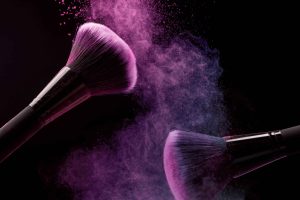 cosmetic-brushes-makeup-powder-dark-background-min-min