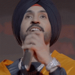 दिलजीत दोसांझच्या दिल्ली कॉन्सर्टवरून वाद:'पटियाला पैग'सह 3 गाणी बंद करण्याची मागणी; गायकाने गन-बुलेट असलेले जॅकेटही घालू नये